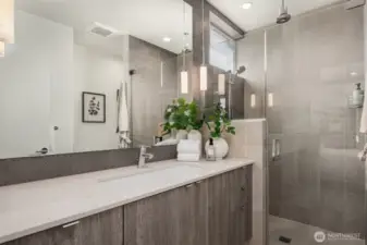 The primary 3/4 bath with rain shower and heated floors.