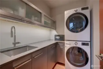Upper level laundry room with six month's new washer and dryer.