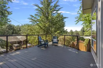 A large Trex deck greets you, offering the perfect place to relax, soak up the sun, dine al fresco, and in the wintertime, take in views of the ship canal, Puget Sound and stunning sunsets.