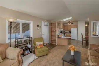 Entrance, living room and kitchen with eating area