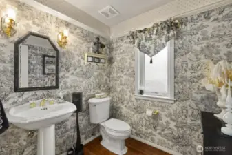 Your powder room is just full of personality located just off of living room and dining room.