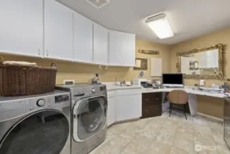 Behind the main floor ¾ bath, you’ll find a versatile utility room that doubles perfectly as a home office or hobby space.