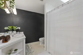 Upstairs full bath has a ton of natural light.