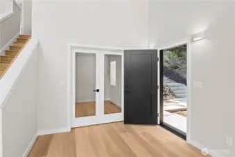 Main floor office has clear French doors to enjoy the incredible Lake Howard view