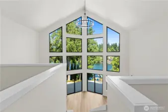 This pictures was taken walking out of the upstairs Primary room.  30 ft floor to ceiling windows to capture the magnificent views!