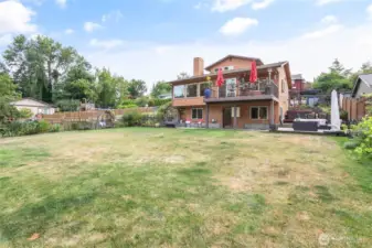 Large fully fenced flat back yard.