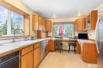 The kitchen features a large pass-through window out to the deck - great for BBQs and entertaining!