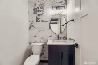 Main-floor guest powder room with modern finishes