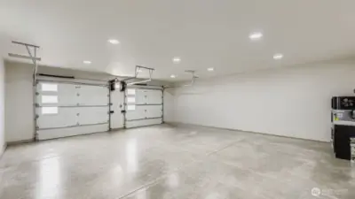 Generously sized insulated garage with painted finish