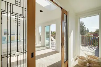Enter Upper level Primary bedroom through gorgeous pocket doors