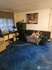 Living room with epoxy flooring throughout