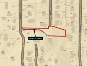 Approximate boundaries in red with approximate route of shared driveway in blue.