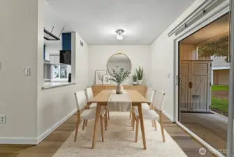 Updated dining area with sliding door directly to patio offering plenty of natural light. Virtually staged to demonstrate potential furniture layout.
