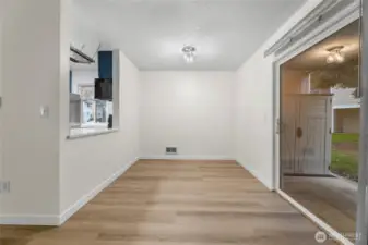 Updated dining area with space for breakfast bar. Sliding door directly to patio offers additional natural light
