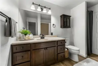 Updated bathroom with new vanity and clean, functional design & plenty of storage.