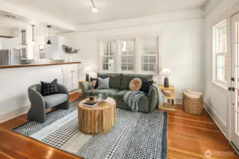 Living room with view into kitchen.