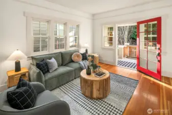 Living room looking out at covered porch.