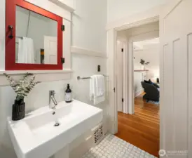 Main floor bath view out to living room.