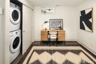 Laundry downstairs is tucked behind closet doors.