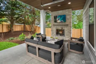 Outdoor covered living area with fireplace