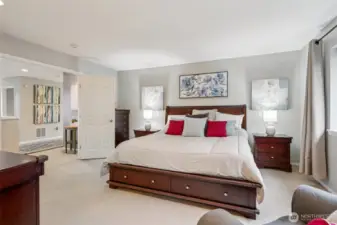 Master bedroom with French doors and ensuite bath.