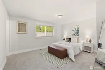 The primary bedroom offers a peaceful place to recharge at the end of the day.