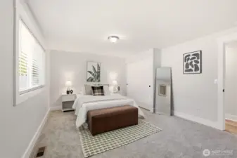 Another bright bedroom that feels calm and welcoming.