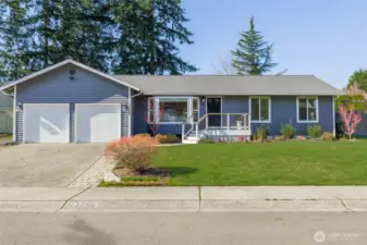 A welcoming front yard that adds to the home’s curb appeal.