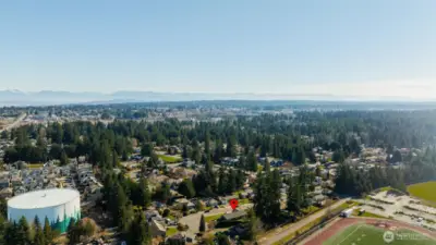 A final aerial view showing the broader area around the home.