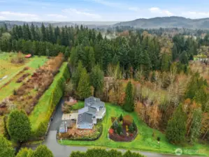 Expansive views stretch across the valley toward the Cascade Mountains, creating a breathtaking backdrop in every season.