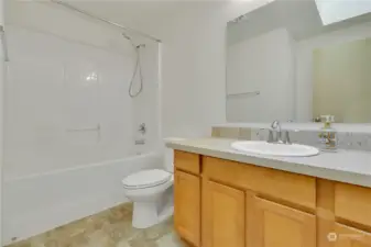 Hall bath with tub/shower combo.