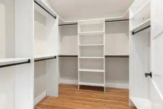 Large Primary walk in closet with custom built-in organizer