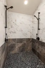 Walk in dual shower with Italian flair large format ceramic tile