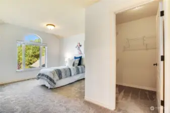 Bedroom with adjoining bathroom & walk-in closet.