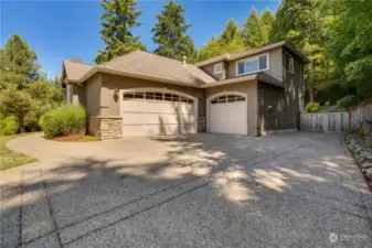 Three car garage with additional space for parking.