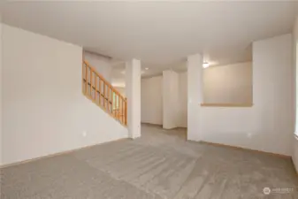 Formal living room looking back towards the entry and stairwell.