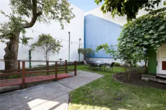 Spacious back yard with shed and garage