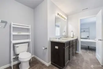 3rd level ensuite bathroom to main bedroom. Double sinks and matching countertops. Large storage closet to the right of door.