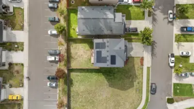 Areal view of 1 year old solar on the roof. Save $ on power! Plenty of parking on the garage, driveway and on the street.