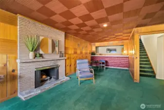Welcome to your very own entertaining space with cozy wood fireplace.  You will be the talk of the town with that wet bar!