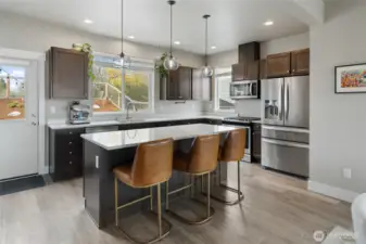 Hand blown glass pendant lights. All great room light fixtures are from Room & Board.