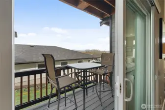 Side deck off the dining area provides seamless dining inside and out.