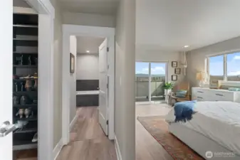 Primary ensuite at the end of the hall for ultimate privacy. Primary Suite includes a walk in closet, 5 piece bath and a knockout view of Mount Baker.
