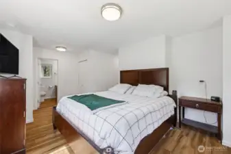 Primary bedroom with dual closets and full private bath. This space is SO bright and cheery!