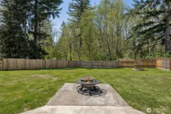 Second patio area for outdoor entertainment - wishing well in backdrop hides the actual private well head.