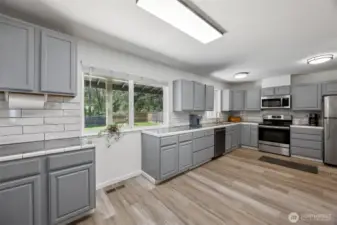 Kitchen offers plenty of space for additional bistro seating.