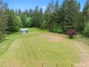 Aerial view of the acreage and the outbuildings on it.