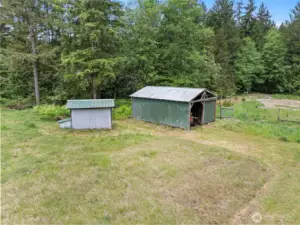 The outbuildings on the property: one is great for machinery storage (or could be used as a 1-horse paddock), the other building is the well house.