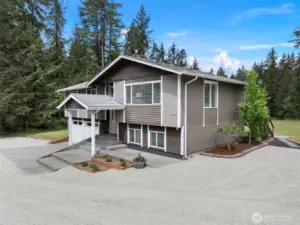 You will love the way this home is nestled in on the 2.47 acres with its massive circular driveway and plenty of parking, yet overlooking the level yard and territorial views.
