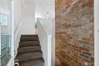 Entryway into this split level home includes a wide outdoor concrete stairway and French doors that both easily open.